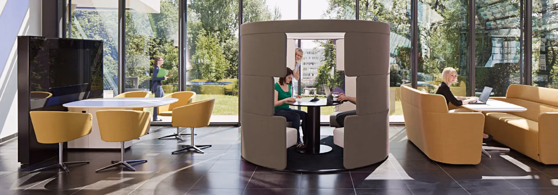 People collaborating in a semi-private Bene PARCS workspace.