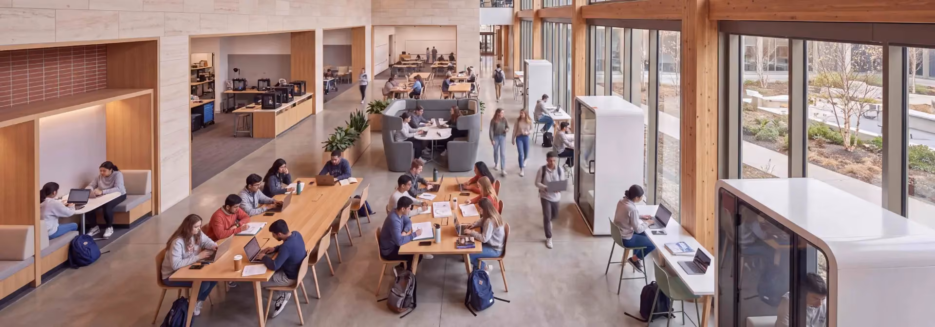 Students using a thoughtfully designed education space with Bene and Hush products.
